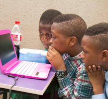 3 children with a laptop